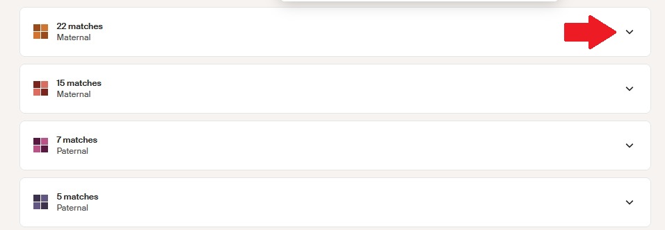 The red arrow points to the caret where you should click to expand the list of cluster members