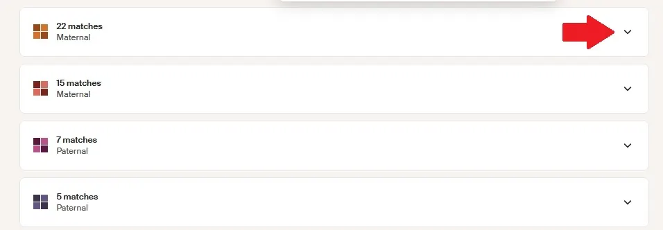 The red arrow points to the caret where you should click to expand the list of cluster members